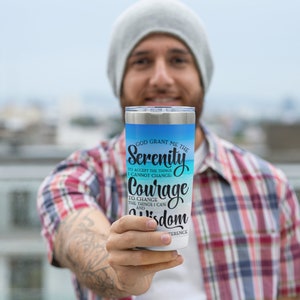 May include: A stainless steel tumbler with a blue and white ombre design. The tumbler features the text "God grant me the Serenity to accept the things I cannot change, Courage to change the things I can, and Wisdom to know the difference."