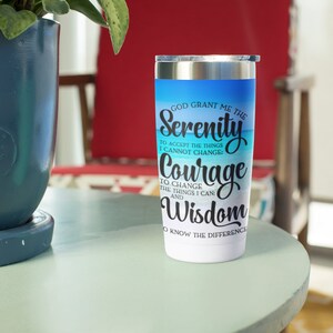 May include: Stainless steel tumbler with a blue and white beach scene and the text "God grant me the Serenity to accept the things I cannot change: Courage to change the things I can: Wisdom to know the difference."