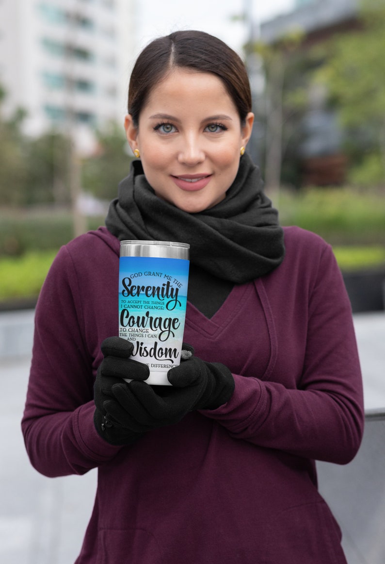 May include: A stainless steel tumbler with a blue and white ombre design. The tumbler features the text "God grant me the Serenity to accept the things I cannot change, Courage to change the things I can, and Wisdom to know the difference."