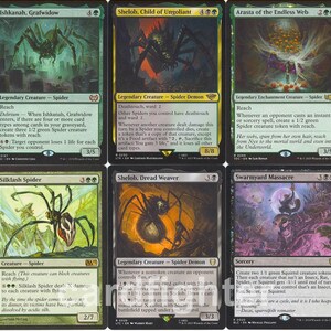 May include: A collection of ten Magic: The Gathering trading cards arranged in two rows. The cards feature various spider-themed illustrations, including Doom Weaver, Ishkanah, Grafwidow, Shelob, Child of Ungoliant, Arasta of the Endless Web, and Vraska, Swarm's Eminence.