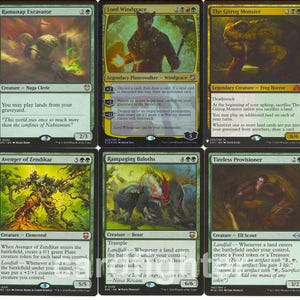 May include: A collection of Magic: The Gathering trading cards. The cards feature various fantasy creatures and characters, with vibrant artwork and text descriptions. The cards are in English and are displayed in a grid.