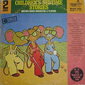 May include: A vintage record album cover featuring three cartoon mice wearing glasses and overalls. The album is titled "Children's Bedtime Stories" and features the Mother Goose Orchestra & Players. The album cover includes a list of songs, including "Lullaby Song", "ABC Song", "Twinkle Twinkle Little Star", and "Pinocchio".