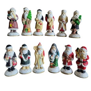 Vintage Santas From Around the World Dated Christmas Bisque Figurine Set of 12