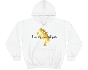 May include: White hooded sweatshirt with a gold silhouette of a woman's head with the text "I wear my crown with pride".