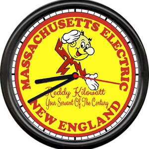 May include: A black and yellow clock with a cartoon character holding a lightning bolt. The clock face reads "Massachusetts Electric, Reddy Kilowatt Your Servant Of The Century, New England".