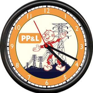 May include: A vintage-style clock with a black frame and an orange face. The clock features a cartoon character with a red hat and a power line tower in the background. The clock face also includes the text "PP&L".