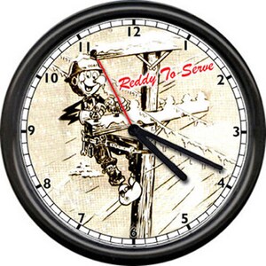 May include: A black and white clock with a cartoon image of a lineman working on a power pole. The clock face has Roman numerals and the text "Reddy To Serve".