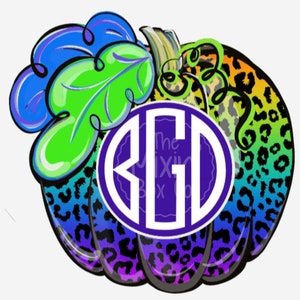 May include: A colorful, rainbow-gradient pumpkin with a black leopard print design. The pumpkin has a white circle with the monogram "KGD" in the center. The pumpkin has a green leaf on top.