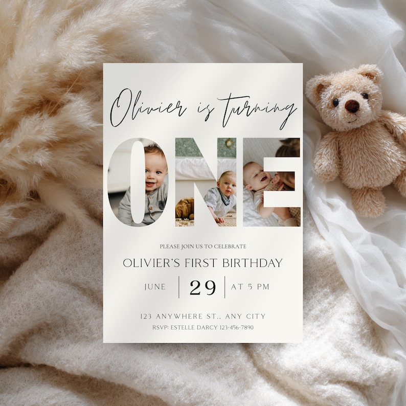 May include: A cream-colored birthday invitation with the text "Olivier is turning ONE." The word "ONE" features photos of a baby. The invitation includes the date, time, and RSVP information. A teddy bear is in the background.