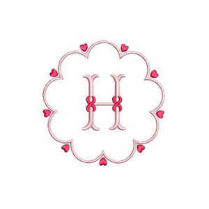 May include: A pink and white monogram with the letter H in the center. The monogram is surrounded by a circle of small pink hearts.