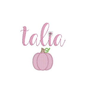 May include: Pink embroidered design with the name "talia" in cursive script and a pink pumpkin with a green stem.