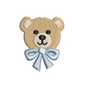 May include: Embroidered teddy bear head with a light brown textured design, black eyes and nose, and a light blue bow. Ideal for baby clothes, nursery decor, or craft projects.