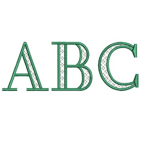 Peut inclure: Un motif brodé en vert des lettres ABC. Les lettres sont soulignées d'un fil vert plus épais et ont un motif de grille blanche à l'intérieur.