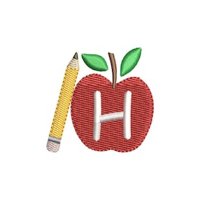 May include: An embroidered design featuring a red apple with a white letter "H" and green leaves, accompanied by a yellow pencil with a gray tip. The design is likely for school or educational themes.