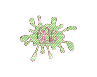 May include: A green paint splatter with a pink monogram in the center. The monogram is the letters "GB" in a script font.