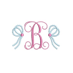 May include: A pink cursive letter "B" with two light blue pearl-like bows on either side.