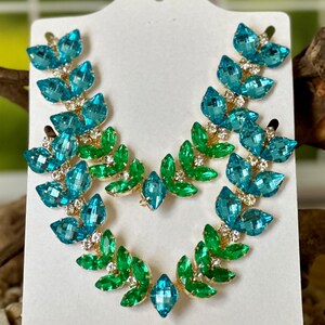Embellishment, Crystal Passions® rhinestone, majestic green, foil back,  27x18.5mm faceted emerald cut fancy stone (4627). Sold individually. - Fire  Mountain Gems and Beads