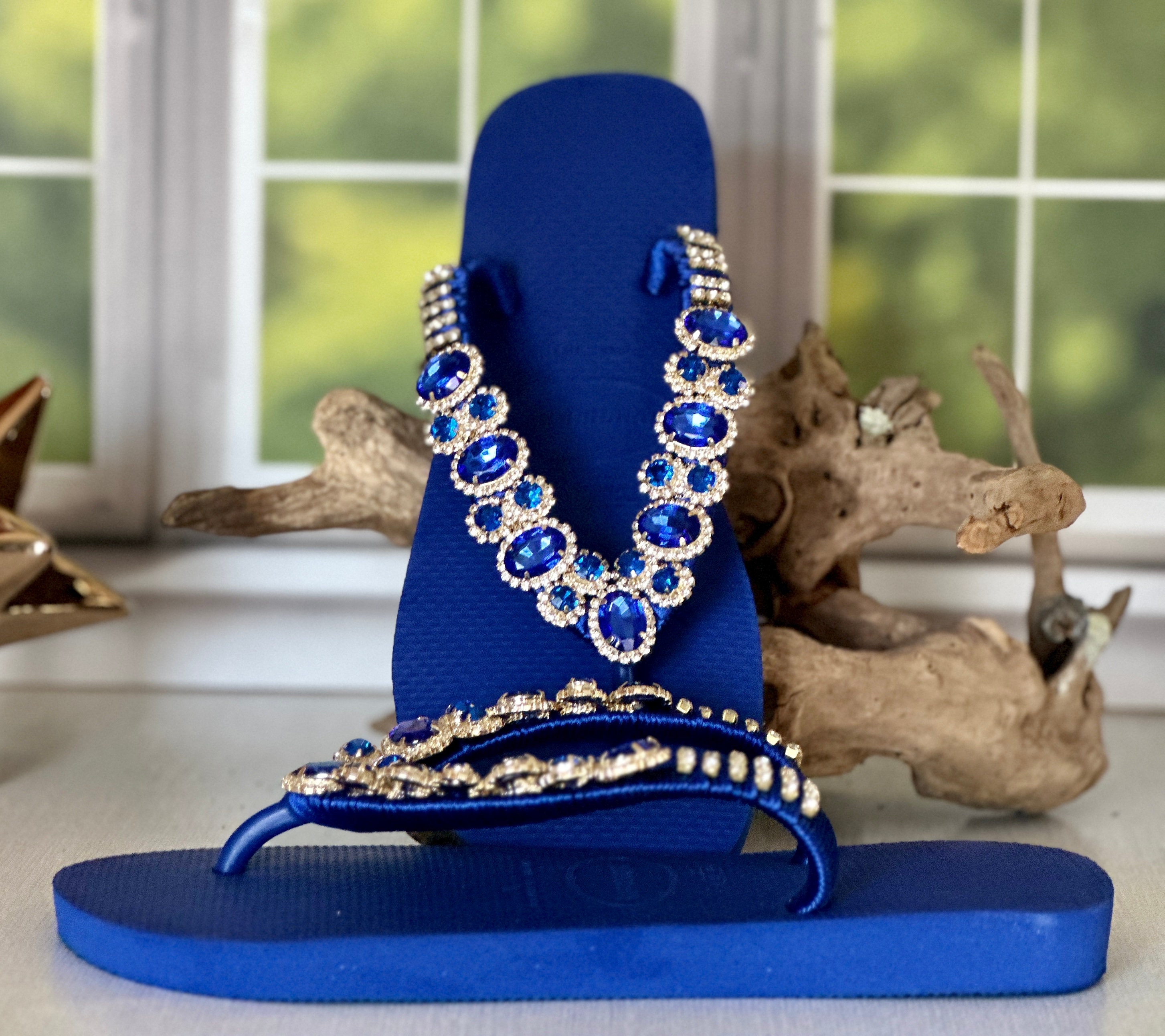 royal blue nike flip flops