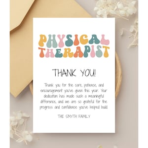 May include: A white card with the words "PHYSICAL THERAPIST THANK YOU!" in colorful, retro-style lettering. The card includes a thank you message from "THE SMYTH FAMILY" and is placed on a wooden plate with a beige envelope.