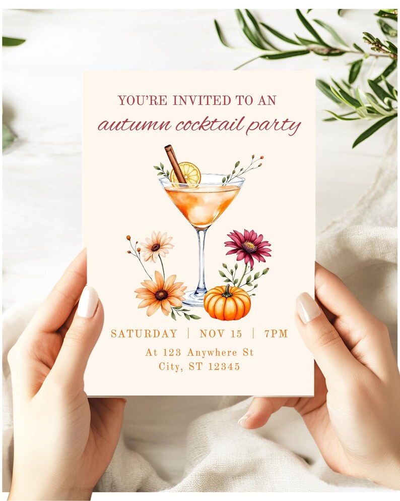 May include: An invitation for an autumn cocktail party. The design features a watercolor illustration of a cocktail, flowers, and a pumpkin. The text reads "YOU'RE INVITED TO AN autumn cocktail party" and includes the date, time, and address.