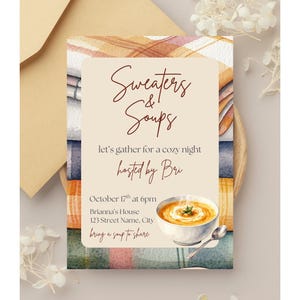 May include: A rectangular invitation card featuring a watercolor plaid background in orange, blue, and cream. The text reads: Sweaters & Soups, let's gather for a cozy night, hosted by Bri, October 17th at 6pm, Brianna's House, 123 Street Name, City, bring a soup to share. A bowl of orange soup with a spoon is illustrated at the bottom.