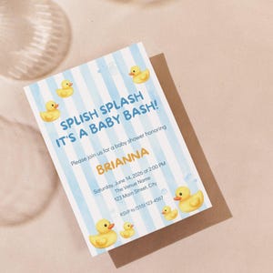 May include: Baby shower invitation with a blue and white striped background and yellow rubber duck illustrations. The invitation reads "Splish Splash It's a Baby Bash!" and includes event details, such as the honoree's name, date, time, and RSVP information.