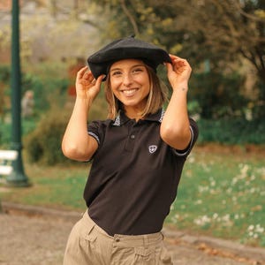 May include: A set of three ceramic mugs with a speckled, matte finish. Each mug features a different color: light blue, cream, and gray. The mugs have a simple, modern design and a comfortable handle.