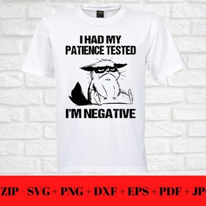 May include: White t-shirt with a black graphic of a grumpy cat and the text "I HAD MY PATIENCE TESTED I'M NEGATIVE." The bottom of the image has a red banner with file type information.