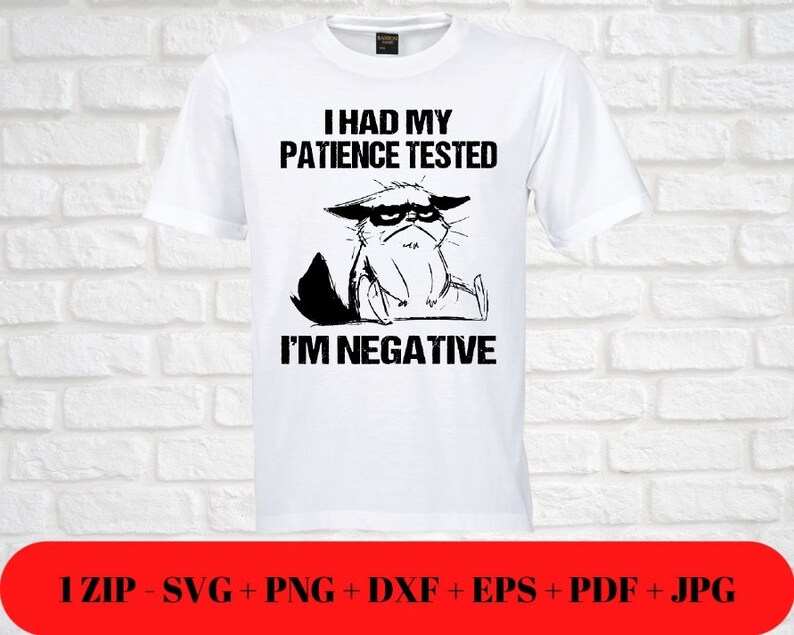 May include: White t-shirt with a black graphic of a grumpy cat and the text "I HAD MY PATIENCE TESTED I'M NEGATIVE." The bottom of the image has a red banner with file type information.