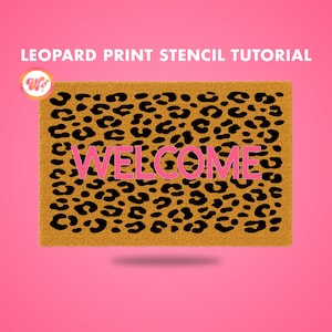 May include: A rectangular doormat with a leopard print design and the word "WELCOME" in pink. The doormat is tan with black spots, set against a pink background. Text at the top reads "LEOPARD PRINT STENCIL TUTORIAL".