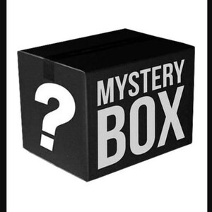 May include: A black box with the words "MYSTERY BOX" printed in white on the front. A white question mark is on the side of the box.