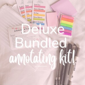May include: A white mesh bag filled with a variety of colorful sticky notes, highlighters, pens, and a card that reads "Deluxe Bundled Annotating Kit!"  The card lists the items included in the kit: sticky tabs, highlighters, gel pens, sticky notes, and a book.