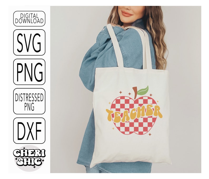 May include: A white tote bag with a red and white checkered apple design and the word "TEACHER" in yellow letters. The bag is being held by a person wearing a blue denim shirt.