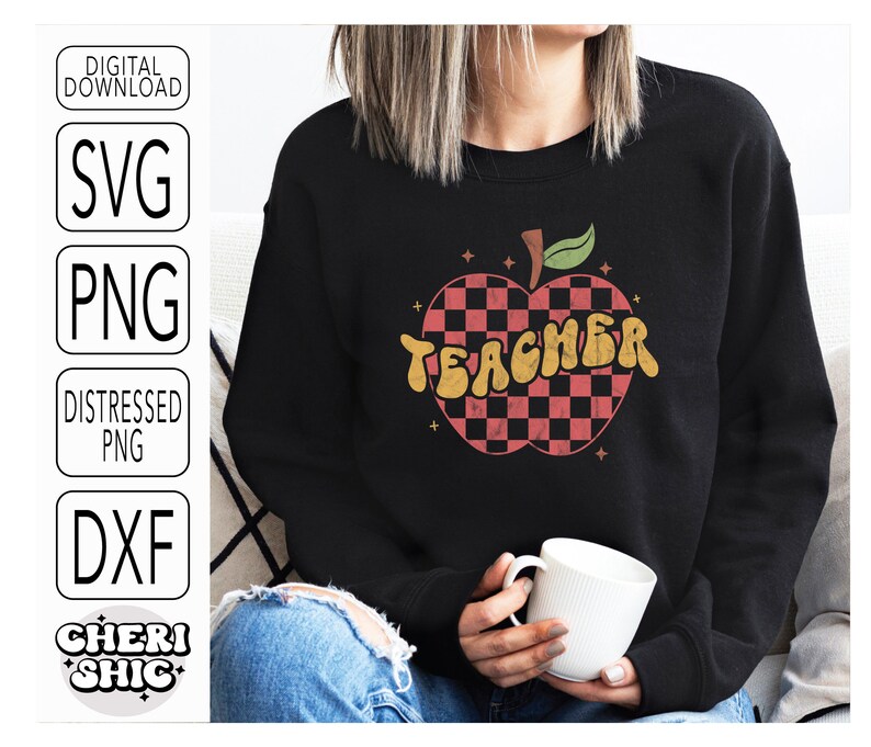 May include: A black sweatshirt with a red and black checkered apple design and the word "TEACHER" in a retro font.