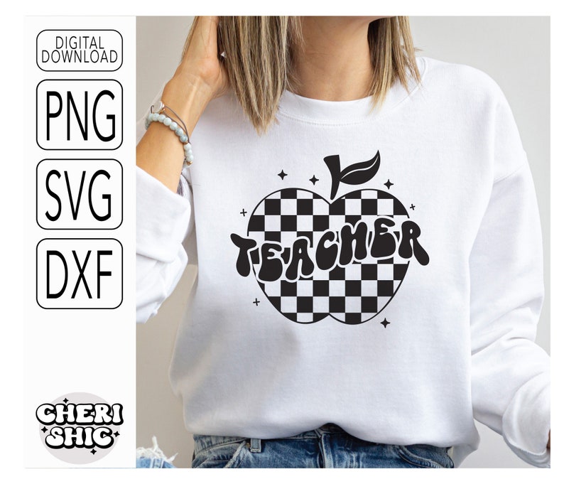 May include: A white sweatshirt with a black and white checkered apple design and the word "TEACHER" in a retro font.