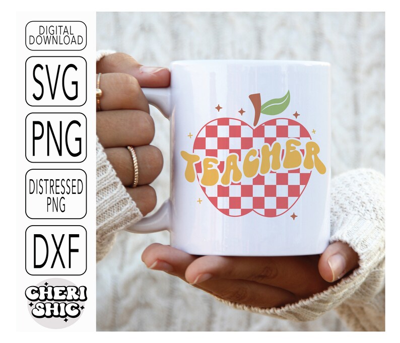 May include: White ceramic mug with a red and white checkered apple design. The apple has a green stem and leaves. The word "TEACHER" is written in yellow letters on the apple.