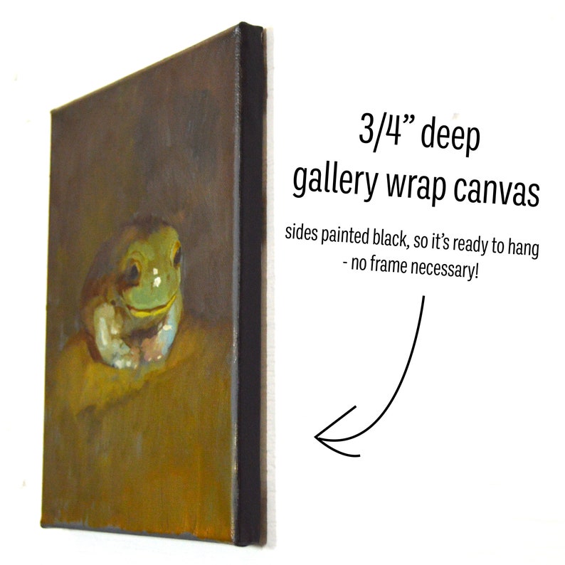 May include: An oil painting on a 3/4 inch deep gallery wrap canvas. The artwork depicts a green frog with a yellow background. The sides of the canvas are painted black, ready to hang without a frame. The text on the image says "3/4" deep gallery wrap canvas" and "sides painted black, so it's ready to hang - no frame necessary!"