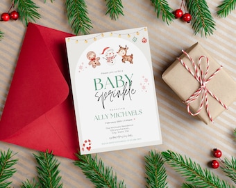 May include: A white baby sprinkle invitation with a watercolour illustration of a gingerbread man, snowman, and reindeer. The text reads "Please join us for a Baby Sprinkle honouring Ally Michaels February 20th 1:00pm The Michaels Residence 125 anywhere City State Zip RSVP to [phone number]"