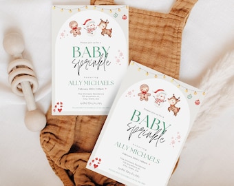 May include: Two white cards with a green and white baby sprinkle invitation. The invitation features a gingerbread man, snowman, and reindeer with a string of lights and ornaments. The text on the card reads "Please join us for a Baby Sprinkle honouring Ally Michaels".
