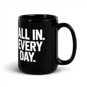May include: Black ceramic coffee mug with a white inscription that reads "ALL IN. EVERY DAY."