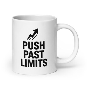 May include: White ceramic mug with a black arrow pointing upwards and the text "PUSH PAST LIMITS" printed on the front.