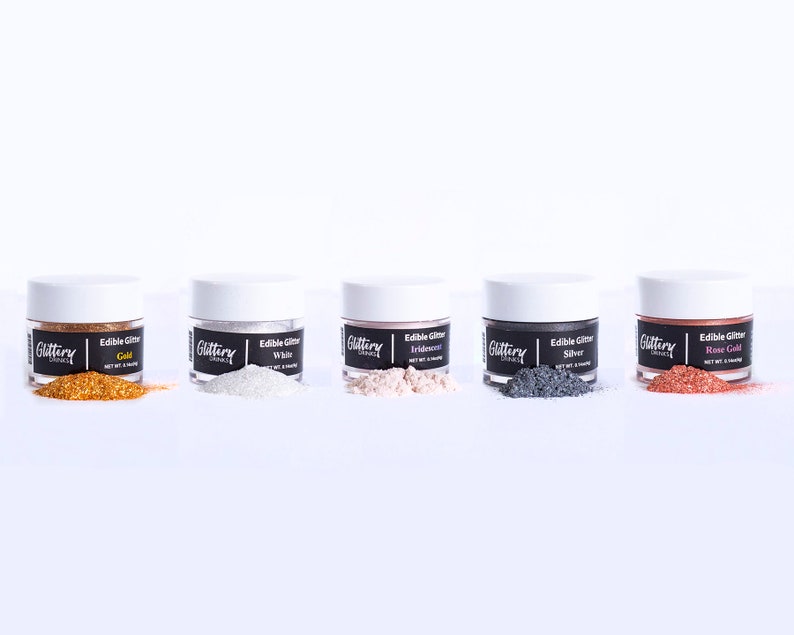 May include: Five small jars of edible glitter in various colors: gold, white, iridescent, silver, and rose gold. Each jar has a black label with the word "Glittery" and the color of the glitter.