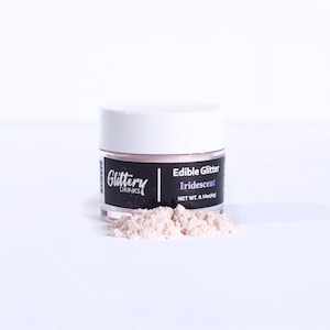 May include: A small jar of iridescent edible glitter, labeled "Glittery Drinks Edible Glitter Iridescent Net Wt. 0.14oz (4g)"