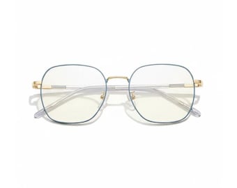 May include: Square-framed eyeglasses with a light blue rim and gold accents. The lenses are clear with a slight yellow tint. The glasses have a minimalist design and are set against a white background.