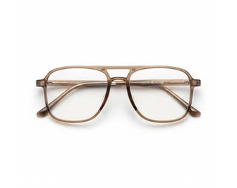 May include: Eyeglasses with a light brown frame and clear lenses. The glasses have a double bridge design and a rectangular shape. The temples are thin and extend to the ear pieces. The glasses are set against a white background.