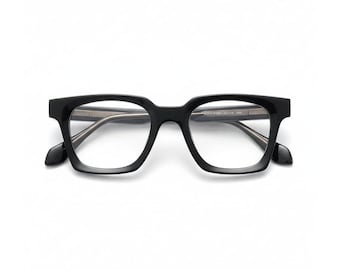 May include: Black square-framed eyeglasses with clear lenses. The glasses have a thick, bold frame design and a classic, timeless aesthetic. The temples are slightly flared, adding a touch of style. The glasses are set against a clean white background.