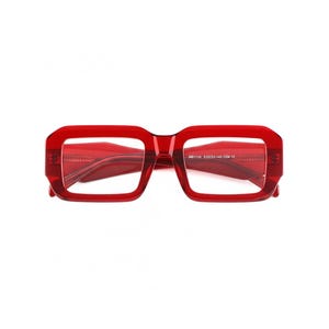 May include: Bright red eyeglasses with a bold, rectangular frame. The glasses have a thick, transparent frame and temples. The text "MB1155 510223-145 C04 CE" is printed on the right temple. The glasses are set against a white background.
