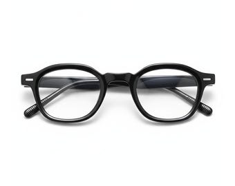 May include: Black, round-framed eyeglasses with clear lenses. The glasses have a classic design with a keyhole bridge and textured temples. The frames are made of a glossy, solid black material, and the lenses are clear.