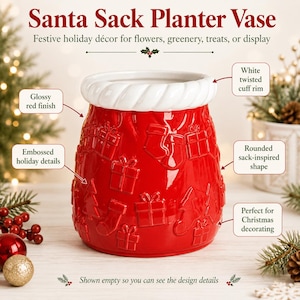 May include: A red ceramic Santa Sack Planter Vase with a glossy finish and a white twisted cuff rim. The exterior features embossed holiday details including gift boxes, stockings, and trees. The vessel has a rounded, sack-inspired shape.