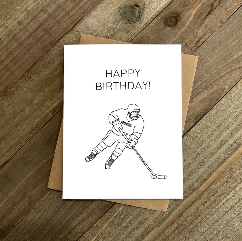 May include: A black and white greeting card with the text "Happy Birthday!" and a line drawing of a hockey player skating with a stick.